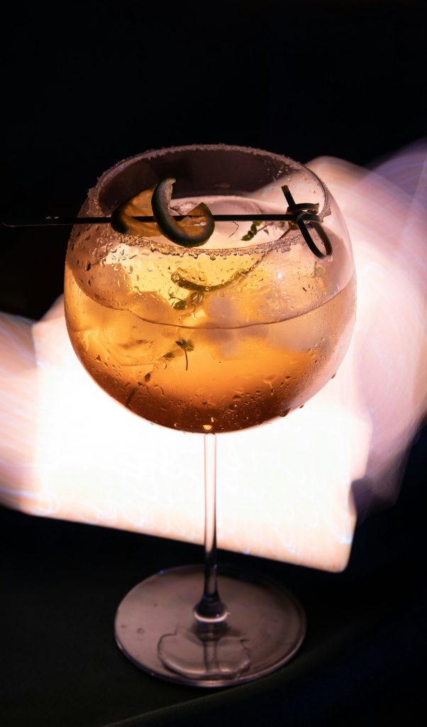 a close up of a wine glass on a table